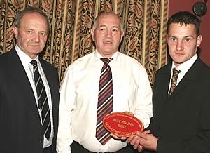 Herbie Crawford, Stephen Crawford and herd competition Mr David Rakin receiving award for Best Large Herd in Northern Ireland