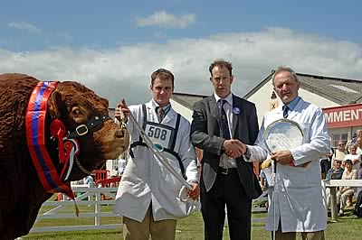 Stephen Crawford at halter, judge Alistair Graham presenting the championship salver to Herbie Crawford